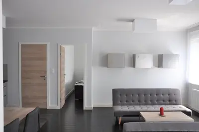 a living room with a couch and a table at Ludwinowska11 Apartments in Kraków