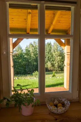 a window with a view of a yard at Wrzosowe Zacisze in Siepraw
