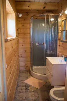 a bathroom with a shower and a toilet at Wrzosowe Zacisze in Siepraw