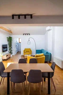 a living room with a table and chairs at WONDER CRACOW in Kraków