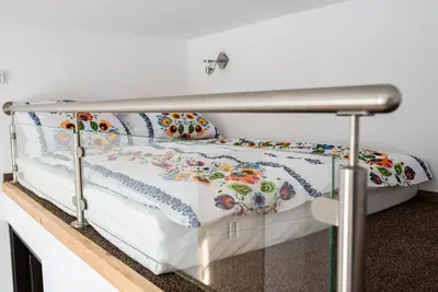 a bed in a room with a metal frame at WONDER CRACOW in Kraków