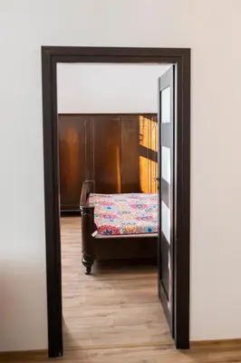 a door leading into a room with a bed at WONDER CRACOW in Kraków