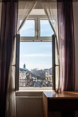 a window with a view of a city at WONDER CRACOW in Kraków