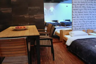 a dining room with a table and chairs and a bowl of fruit at Apartment with GARDEN in CITY CENTER in Kraków