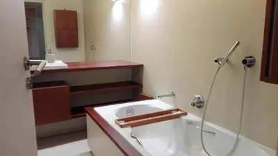a bathroom with a tub and a sink and a shower at Apartment with GARDEN in CITY CENTER in Kraków