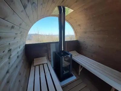an inside view of a sauna with a stove at Bacówka na Zadzielu in Laskowa