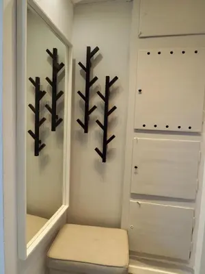 a dressing room with a mirror and a stool at Apartament Mazowiecka 125 in Kraków