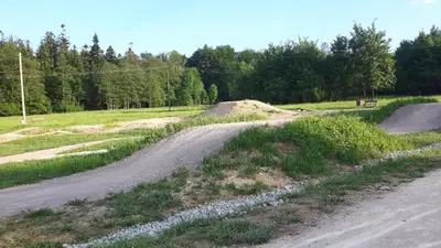 a dirt road in the middle of a field at Pokoje u Zajdy in Zawoja