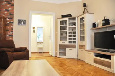 a living room with a couch and a television at Tenczyńska 4 by Homeprime in Kraków