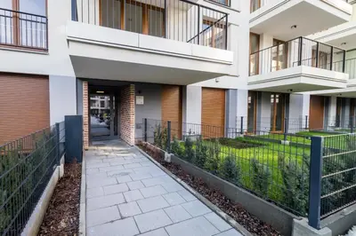 a walkway in front of a building at Apartamenty Rakowicka WAWELOFTS in Kraków