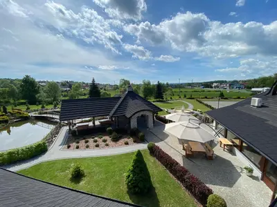 an aerial view of a house with a water park at Hotel Tadeusz in Uszew