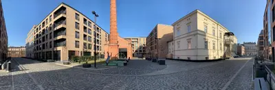 a city street with buildings and a tall tower at Lubicz Luxury Apartment in Kraków