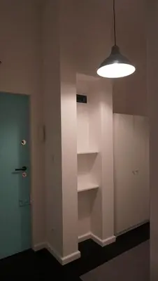 an empty room with a light and a door at Lovely Bubbly Apartment in Kraków