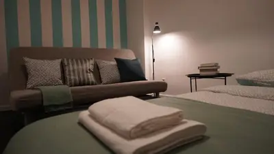 a living room with a couch and a bed at Lovely Bubbly Apartment in Kraków
