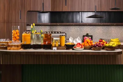 a buffet of fruits and juice on a table at Park Inn by Radisson Krakow in Kraków