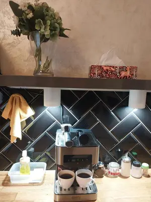 a kitchen counter with a sink and a microwave at Nowy Kleparz Centrum Krakowa in Kraków