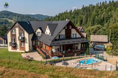 an aerial view of a house with a swimming pool at Dom Wypoczynkowy Modrys in Zawoja