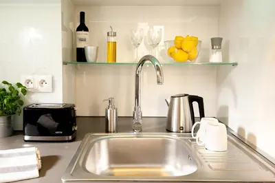 a kitchen counter with a sink and a kitchen counter at Spanko w Krakowie in Kraków