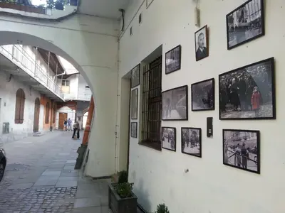 a wall with pictures on the side of a building at Spanko w Krakowie in Kraków