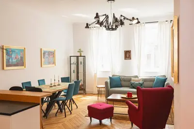 a living room with a table and a couch at TCF Home - Big Apartment with Free Garage in Kraków