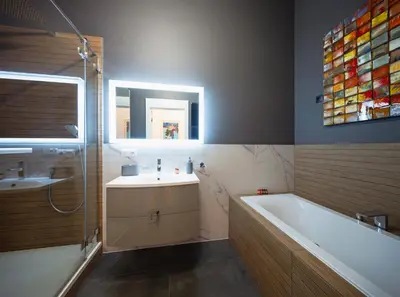 a bathroom with a bath tub and a sink at TCF Home - Big Apartment with Free Garage in Kraków