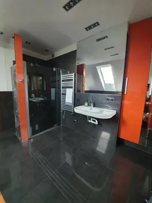 a bathroom with a tub and a sink and a shower at Villa ENERGY in Zator