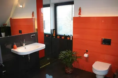 a bathroom with a white sink and a toilet at Villa ENERGY in Zator
