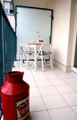 a fire hydrant on a patio with a table and chairs at Friedleina 7 Kamienica Prezydencka in Kraków