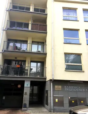 an apartment building with balconies on the side of it at Friedleina 7 Kamienica Prezydencka in Kraków