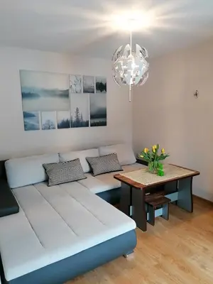 a living room with a couch and a table at Agroturystyka 