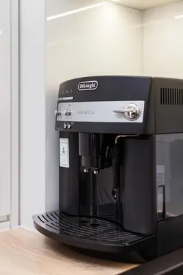a black coffee maker sitting on top of a counter at City of the Kings - Inca Apartment in Kraków