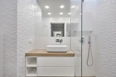 a white bathroom with a sink and a shower at RAJSKA 3 by PI Apartments in Kraków