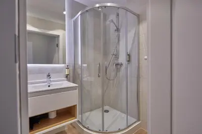 a bathroom with a shower and a sink at RAJSKA 3 by PI Apartments in Kraków