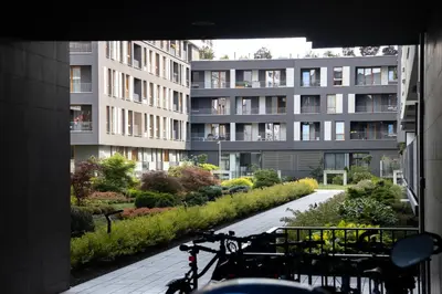 a bike is parked in front of a building at Unique apt EVE - free garage in Kraków