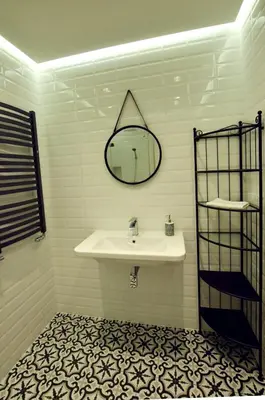 a bathroom with a sink and a mirror on the wall at Jewish Quarter Comfort - In City Apartments in Kraków