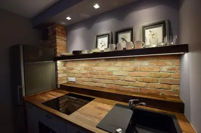 a kitchen with a brick wall and a sink at Jewish Quarter Comfort - In City Apartments in Kraków