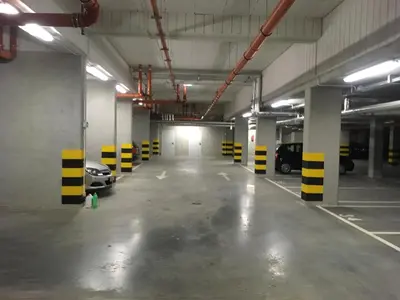 an empty parking garage with cars parked in it at Brown Sugar | free garage | 2 separate rooms in Kraków