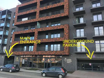 a building with signs on the side of it at Brown Sugar | free garage | 2 separate rooms in Kraków