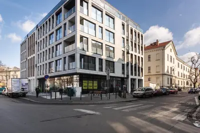 a tall building on the corner of a city street at Rajska 3 by Atrium Apartments in Kraków