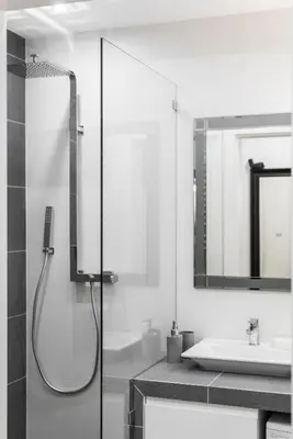 a bathroom with a shower and a sink at Rajska 3 by Atrium Apartments in Kraków
