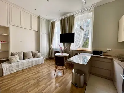a living room with a couch and a table at Tresor Barska Apartments in Kraków