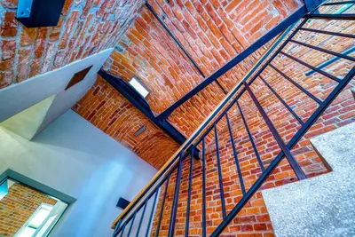 an overhead view of a brick wall and staircase at Aparthotel Delta Boutique in Kraków
