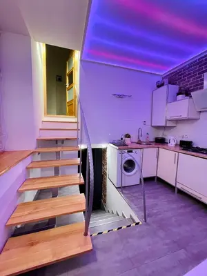 a stairway in a kitchen with a staircase in a house at XXL Apartment Old Town 24 h - check in, Wi-Fi in Kraków