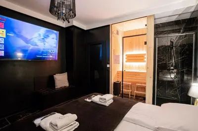 a kitchen with a sink and a counter top at Jacuzzi Glass-House Central Station in Kraków