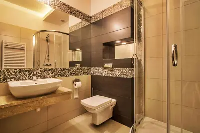 a bathroom with a toilet and a sink and a shower at Hotel Tatarscy - ENERGYLANDIA in Kalwaria Zebrzydowska