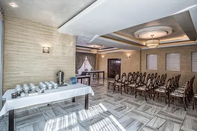 a meeting room with tables and chairs in a building at Hotel Tatarscy - ENERGYLANDIA in Kalwaria Zebrzydowska