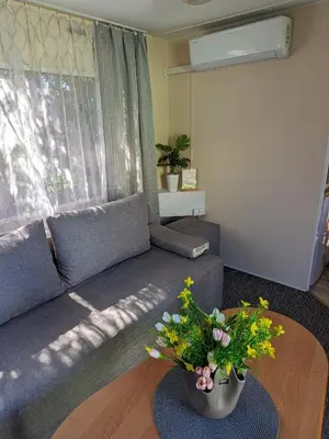 a living room with a couch and a table at Riviera Zator in Zator