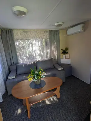 a living room with a couch and a table at Riviera Zator in Zator