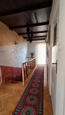 a small kitchen with a sink and a microwave at Pokoje Gościnne U Ewy in Wieliczka