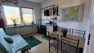 a room with a bed and a desk in it at Pokoje Gościnne U Ewy in Wieliczka